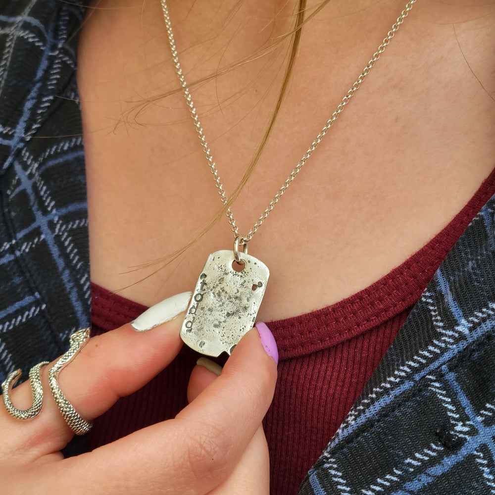 girl wearing ashes jewelry, cremation memorial ashes